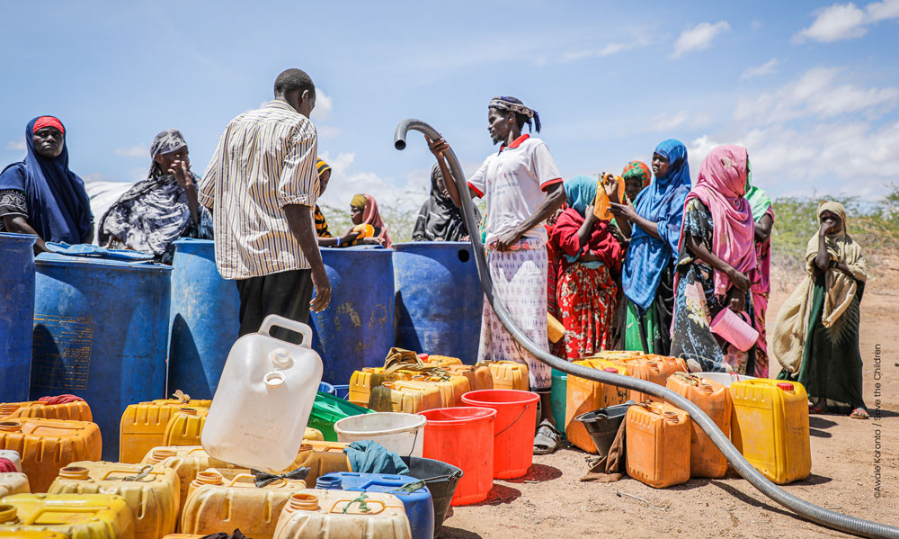 People queuing to get clean water after floods destroyed infrastructure in Southern Somalia